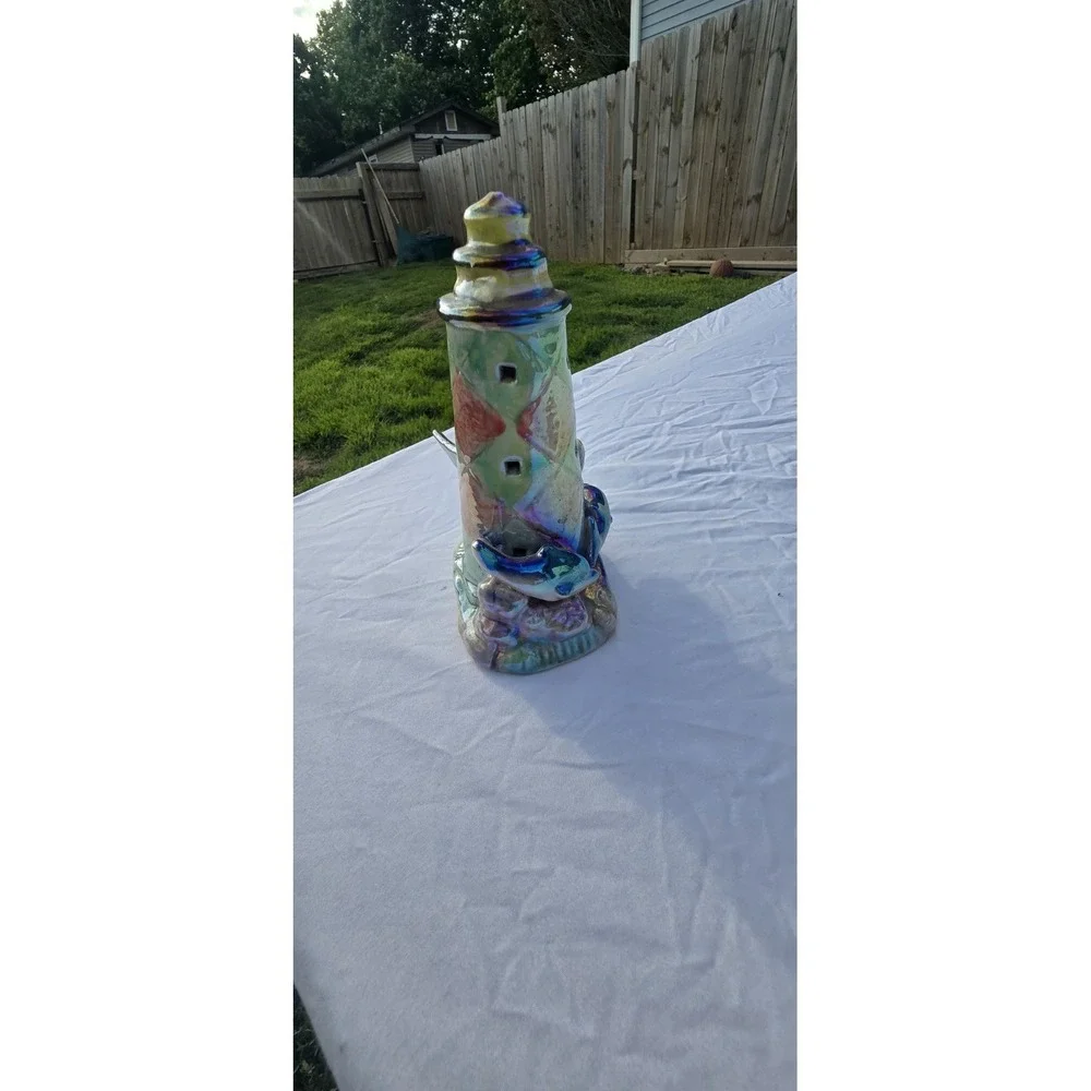 vintage iridescent ceramic dolphin lighthouse figurine